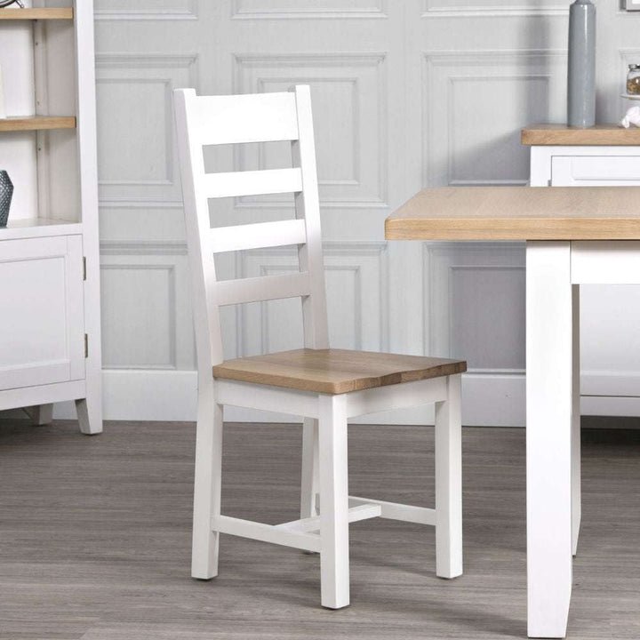 Derwent White Wooden Ladder Back Chair lifestyle image of the chair
