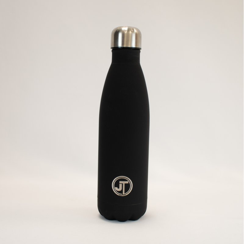JT Fitness Black Stainless Steel 500ml Water Bottle image of the bottle on a beige background