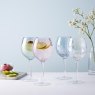 Simply Home 4 Piece Glass Gin/Wine Set on a kitchen worktop filled with drinks, ice and fruits