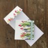 Alex Clark Flowers Mini Magnetic Notepad front and inside on a wooden table