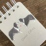 Alex Clark Clever Collies Dog Small Spiral Notepad close up of the front cover on a wooden table