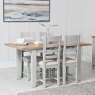 Derwent Grey 1.2m Table and 4 Fabric Ladder Back Chairs lifestyle image of table and chairs