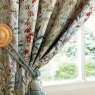 Laura Ashley Pointon Fields Multi Ready Made Curtains close up lifestyle image of the curtains and curtain tie backs