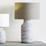 Alina Tall White Dot Stoneware Table Lamp with Natural Linen Shade lifestyle image of the lamp