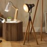 Larkin Grey Metal And Natural Wood Tripod Film Table Lamp lifestyle image of the lamp