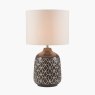 Athena Dark Grey Geo Ceramic Table Lamp image of the lamp turned on on a white background