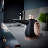 Tower Black And Rose Gold Handheld Steam Cleaner lifestyle image of the steam cleaner