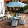 Havana 4 Seater Round Dining Set lifestyle image of the dining set on a garden patio