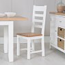 Derwent White 1.2m Extendable Table With 4 Wooden Ladder Back Chairs lifestyle image of the chair