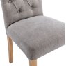 Button Back Scroll Top Dining Chair In Grey close up image of the chair on a white background