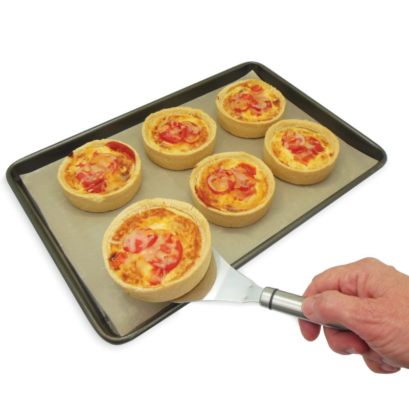 Neat Ideas Non Stick Cooking Liner in use on a baking tray with food