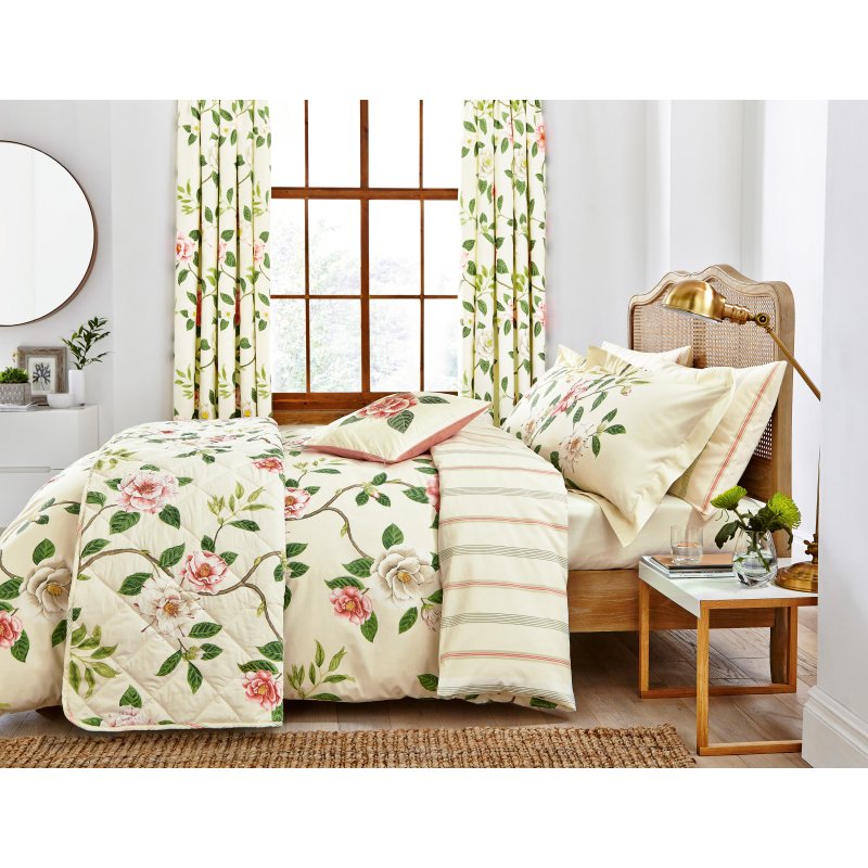 Sanderson Options Christabel Coral Duvet Cover Set on a bed in a bedroom