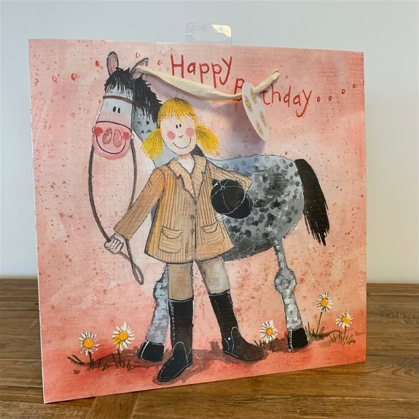 Alex Clark Girl & Horse Large Gift Bag sat on a wooden table