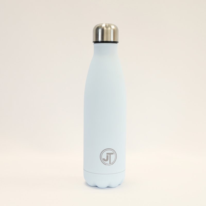 JT Fitness Baby Blue Stainless Steel 500ml Water Bottle image of the bottle on a beige background