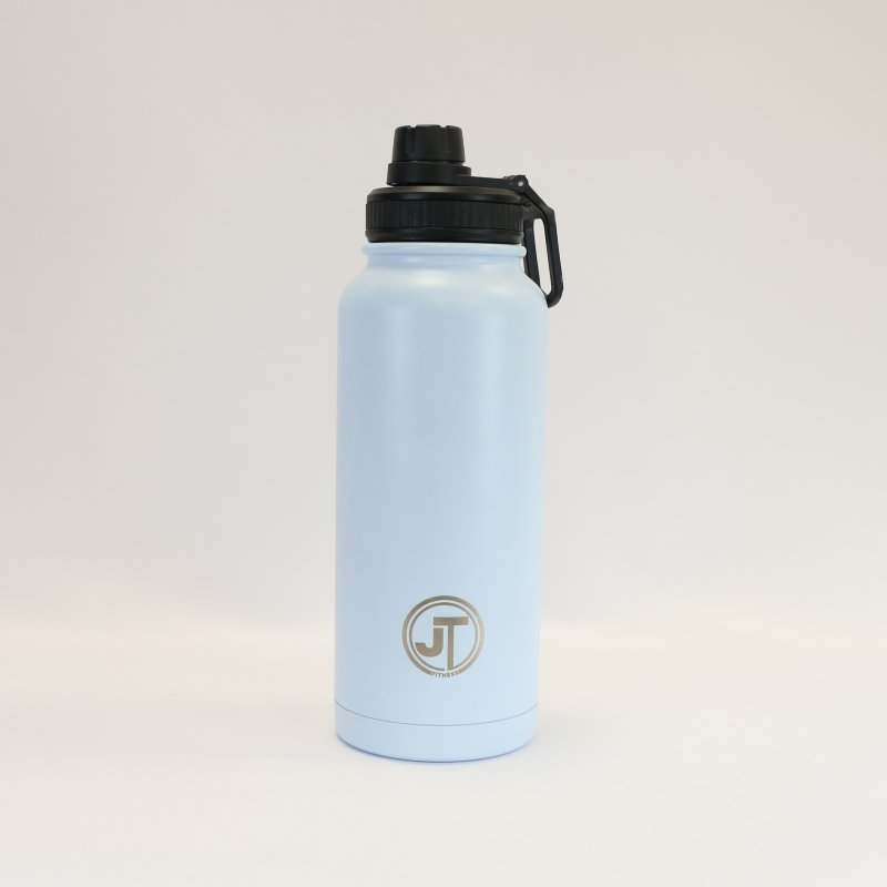 JT Fitness Baby Blue 1000ml Flip Lid Water Bottle image of the bottle on a beige background