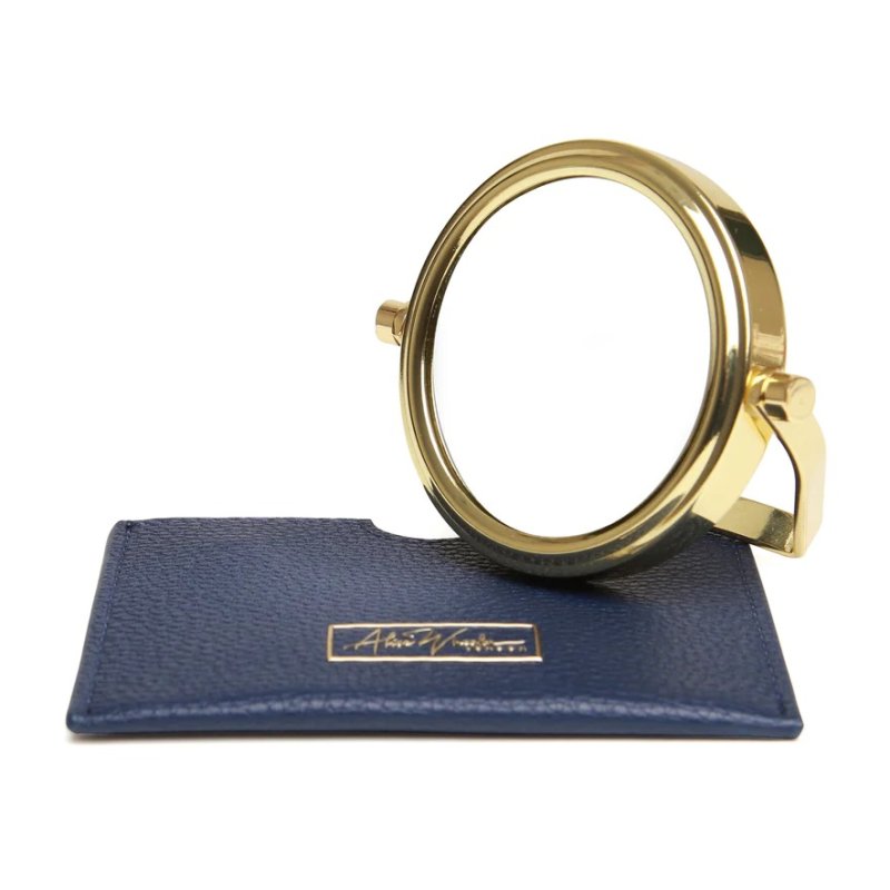 Alice Wheeler Navy Mirror And Pouch image of the mirror and the pouch on a white background
