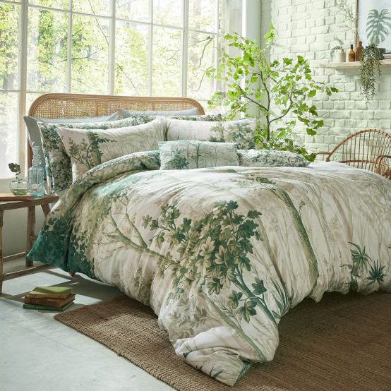 Graham & Brown Coppice Forest Sage Duvet Cover Set lifestyle image of the duvet cover set