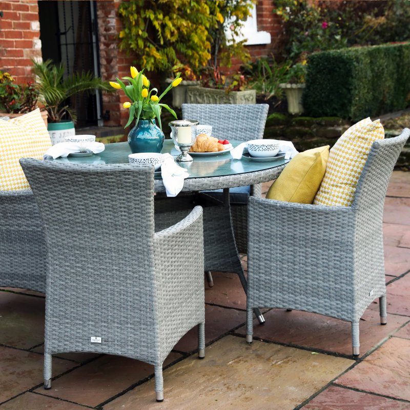 Havana 4 Seater Round Dining Set lifestyle image of the dining set on a garden patio