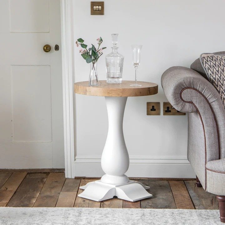 Holkham Oak Round Wine Table lifestyle image of the wine table on a white background