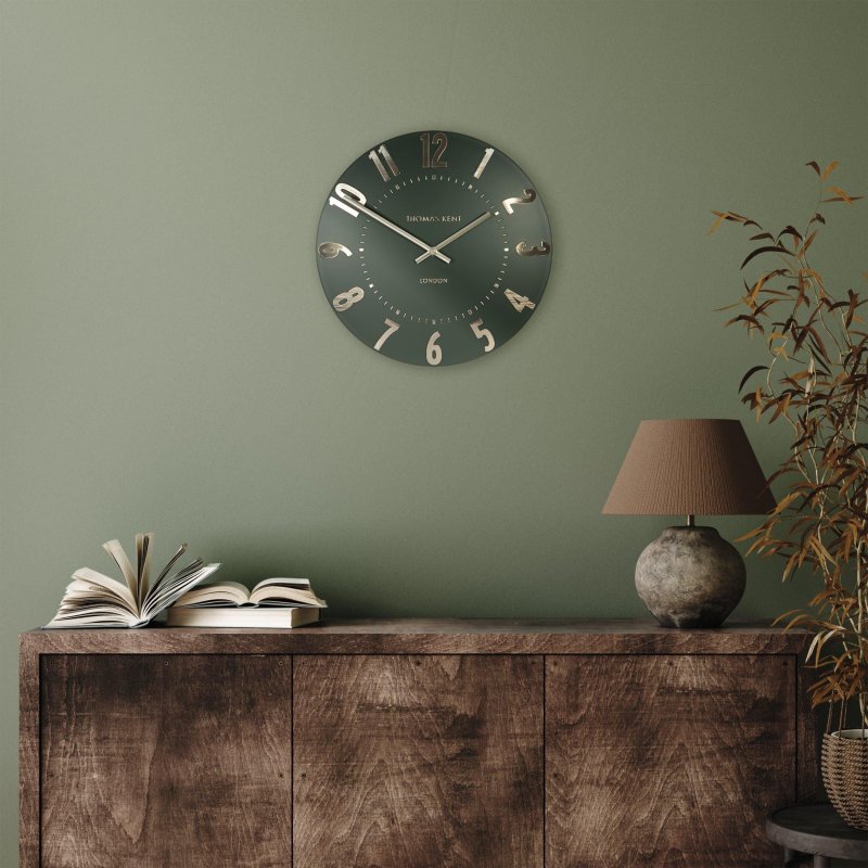 Thomas Kent Arabic 12" Olive Green Wall Clock lifestyle image of the clock
