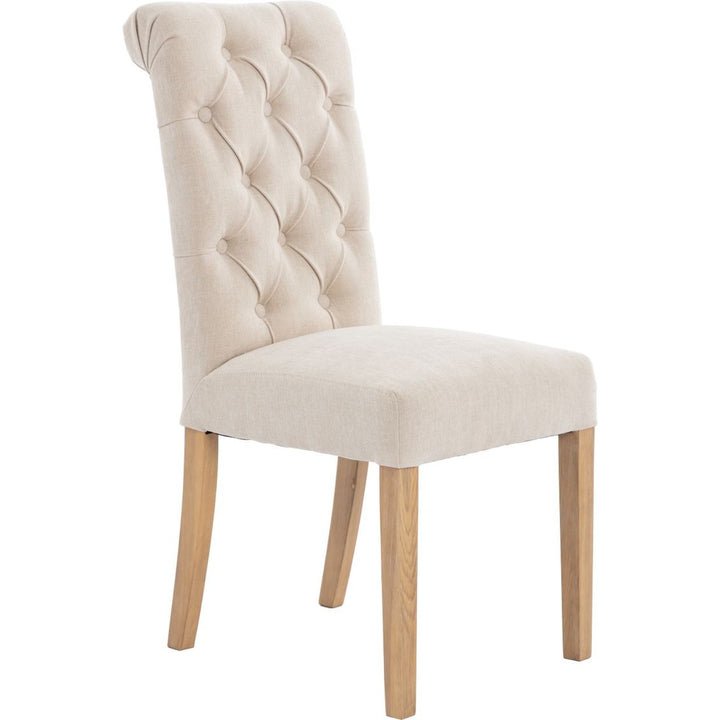 Button Back Scroll Top Dining Chair In Natural angled image of the chair on a white background