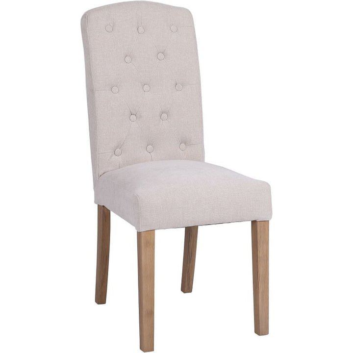 Button Back Dining Chair In Natural angled image of the chair on a white background