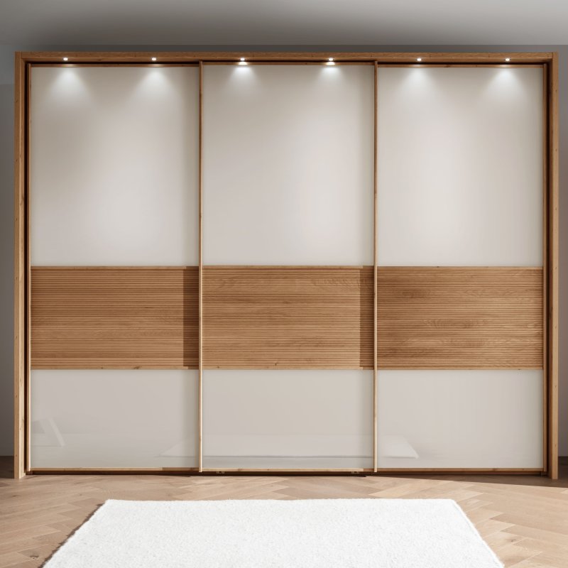 Wiemann Manhattan 3 Door Sliding Wardribe In Champagne Glass With Wooden Trim And Frame With Lights lifestyle