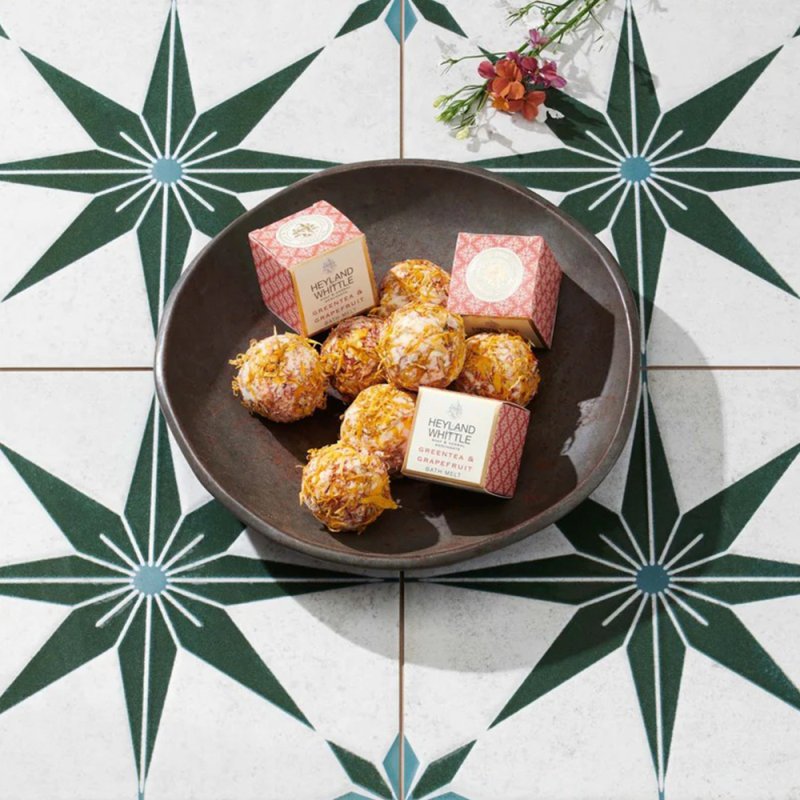 Greentea & Grapefruit Bath Melt Truffle 40g in bowl on tiled floor
