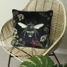 Midnight Garden Bee Cushion Black on Wicker chair
