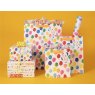 Glick Large Birthday Balloon Gift Bag on a yellow background with other bags