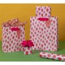 Glick Medium Sweet Strawberries Gift Bag lifestyle with different size gift bags and gift wrap