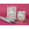 Glick Small Peonies and Foxglove Gift Bag on a pink background with different size gift bags and gift wrap