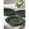 M.M Living Bobble Green Dinner Plate with other dinner plates on a dining table