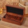 Harvey Makin Dominoes in Wooden Box open with dominoes inside on a wooden table