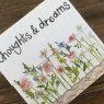Alex Clark Thoughts and Dreams Flowers Mini Magnetic Notepad close up of front on a wooden table