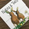 Alex Clark Notes & Tails Rabbit Mini Magnetic Notepad close up of front cover on a wooden table