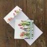 Alex Clark Flowers Mini Magnetic Notepad front and inside on a wooden table