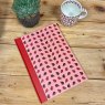 Alex Clark Lovely Ladybirds Hardback Journal front cover on a wooden table