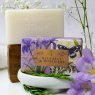 The English Soap Company Anniversary Bluebell and Rosemary Soap packaging and soap together lifestyle
