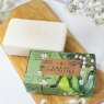 The English Soap Company Anniversary Lily of The Valley Soap bar of soap and packaging next to eachother
