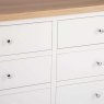 Derwent White 6 Drawer Chest close up of closed drawers on a white background
