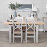 Derwent Grey 1.2m Table and 4 Wooden Cross Back Chairs lifestyle image of the table and chairs