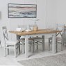 Derwent Grey 1.2m Table and 6 Fabric Cross Back Chairs lifestyle image with the table and chairs