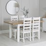 Derwent White 1.2m Table and 4 Wooden Cross Back Chairs lifestyle image of table and chairs