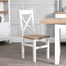 Derwent White 1.2m Table and 6 Wooden Cross Back Chairs lifestyle image of the chair
