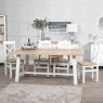 Derwent White 1.8m Table and 4 Wooden Cross Back Chairs lifestyle image of the table and chair