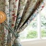 Laura Ashley Pointon Fields Multi Ready Made Curtains close up lifestyle image of the curtains and curtain tie backs
