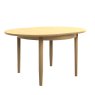 Warwick Oak Round Crown Dining Table on Legs side angle of the table on a white background