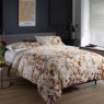 The Lyndon Company Watercolour Spice Meadow Duvet Cover Set side on lifestyle image of the bedding