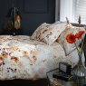 The Lyndon Company Watercolour Spice Meadow Duvet Cover Set side on lifestyle image of the bedding